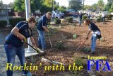 Lemoore High's Future Farmers of America students Jordan Lee, Alex Walker and Katelyn Pedersen help put the finishing touches on Lemoore City Hall's landscaping project.